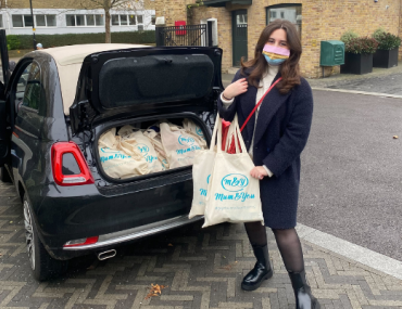 Car boot filled with christmas donations to local baby banks. 